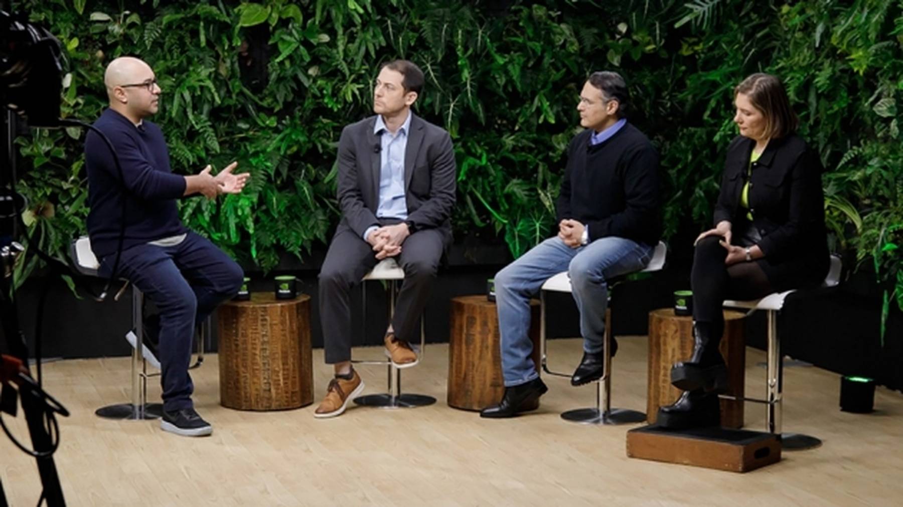 Business leaders discuss AI at a conference