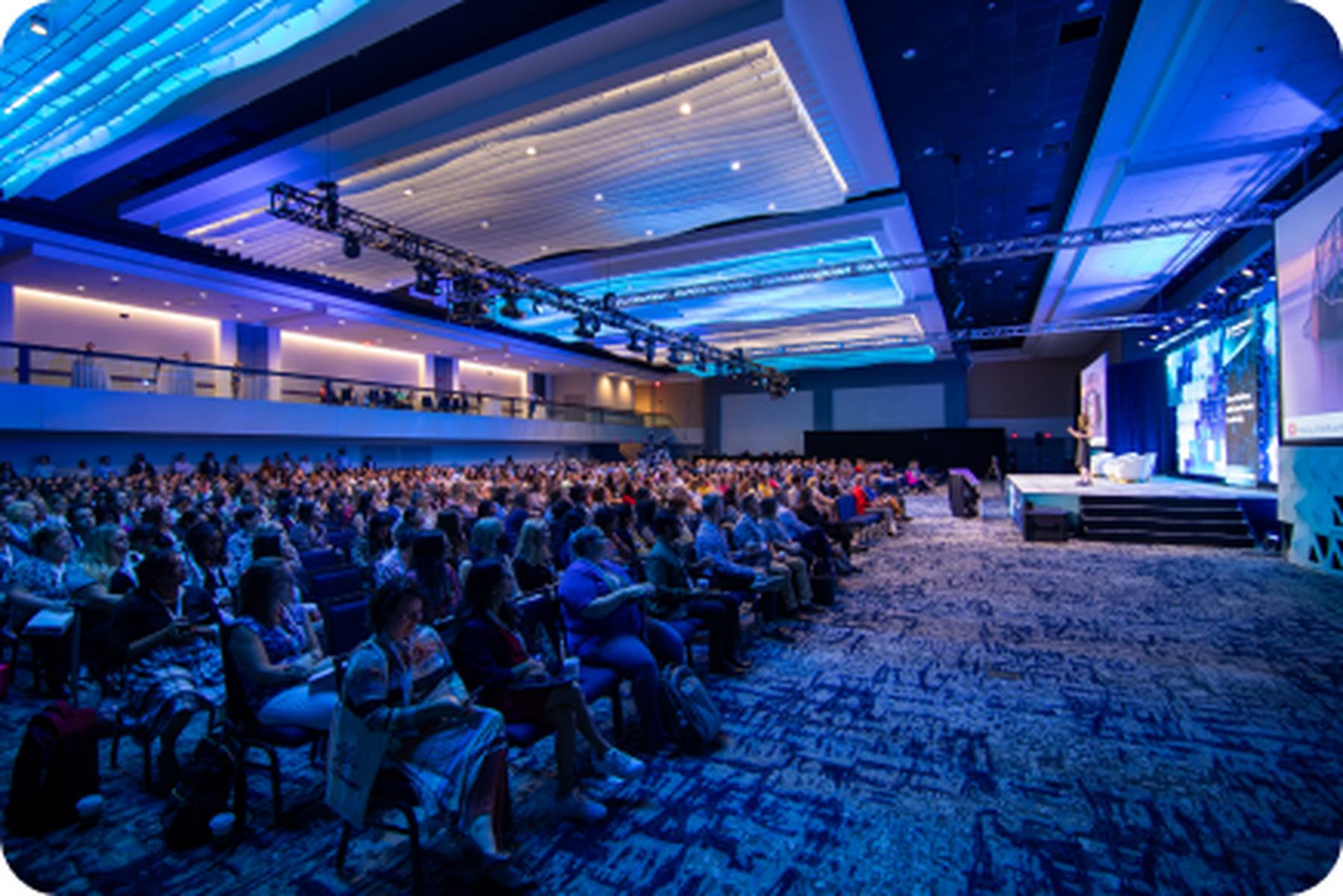 A large conference room full of attendees.