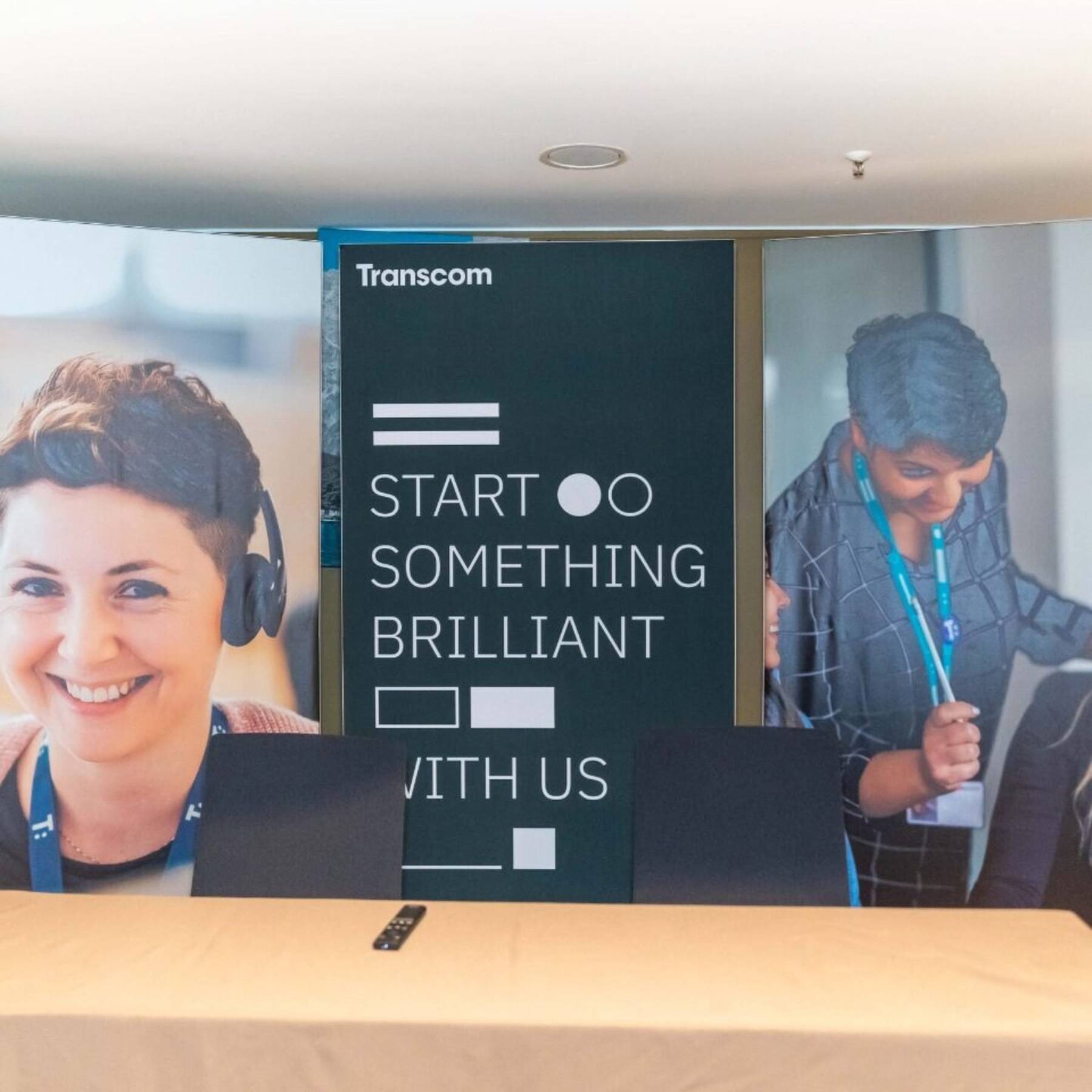 The display suggests a focus on customer service or call center operations, with a covered table in front.